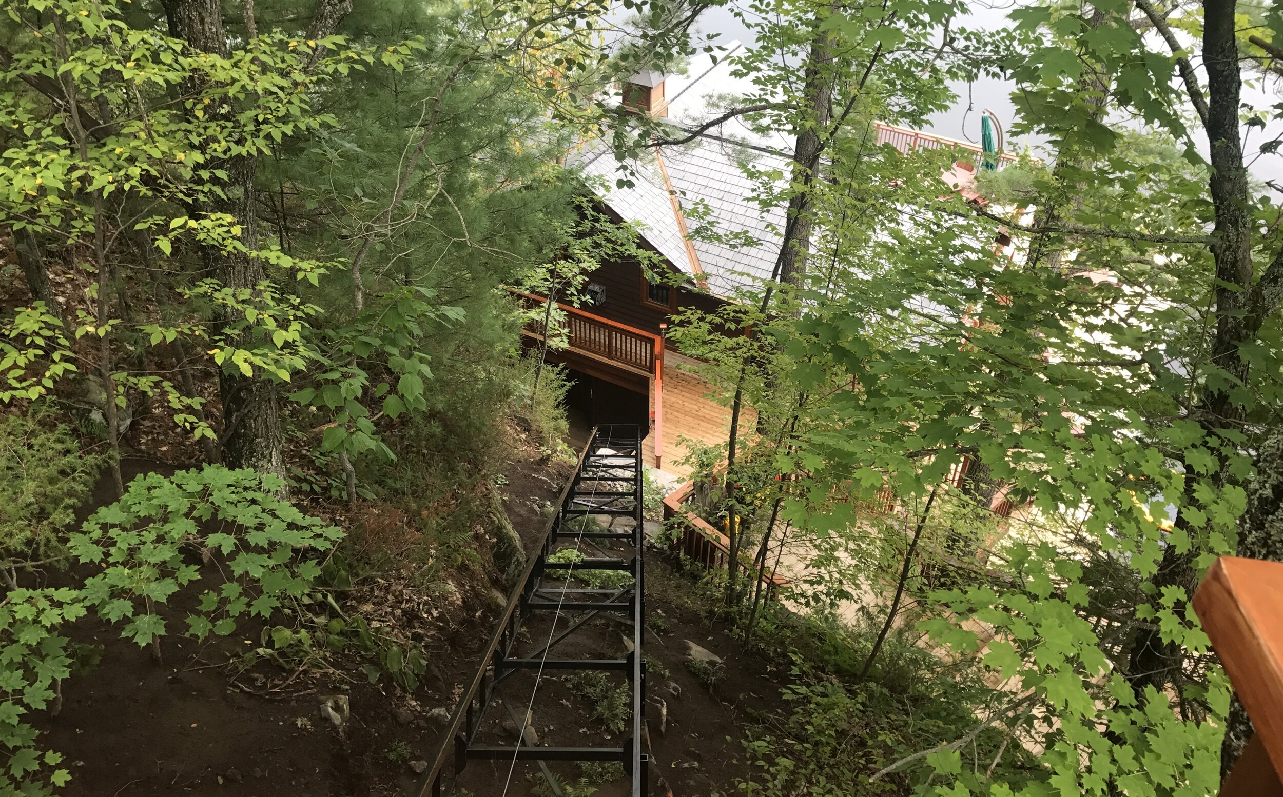 The lift connects the main level of the cottage to the rooftop level of the boathouse.