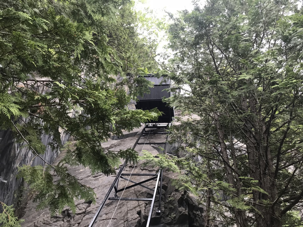 Looking up at the car halfway up the track. The angle formed by the track and the car floor gives a sense of the steepness.