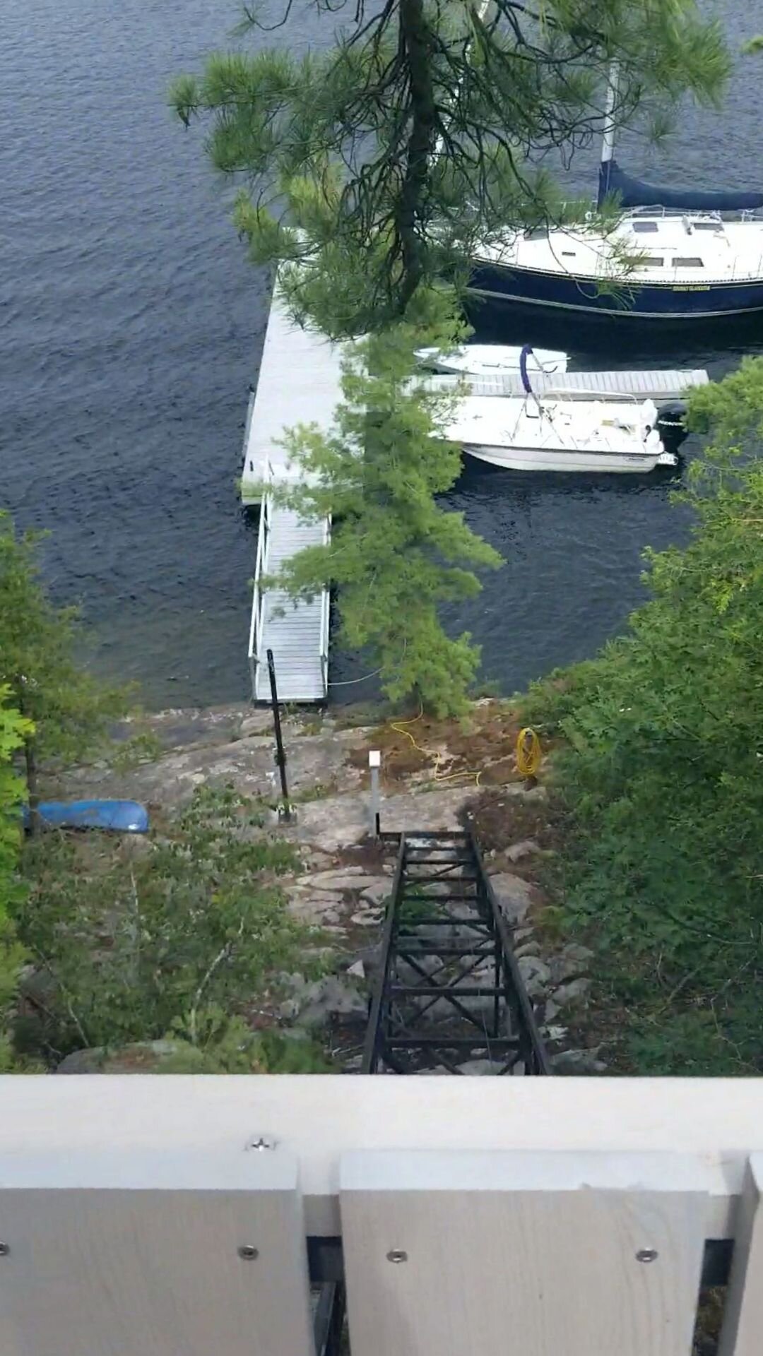 Sailor took to the lift as if it were an old friend. We designed the lower station to use this stone step as a platform, minimizing the lift's impact on the local environment, especially when the car is parked. Keeping the track tight to the hill also leaves the lakeside path in the foreground clear for walking. We use the natural terrain whenever we can.