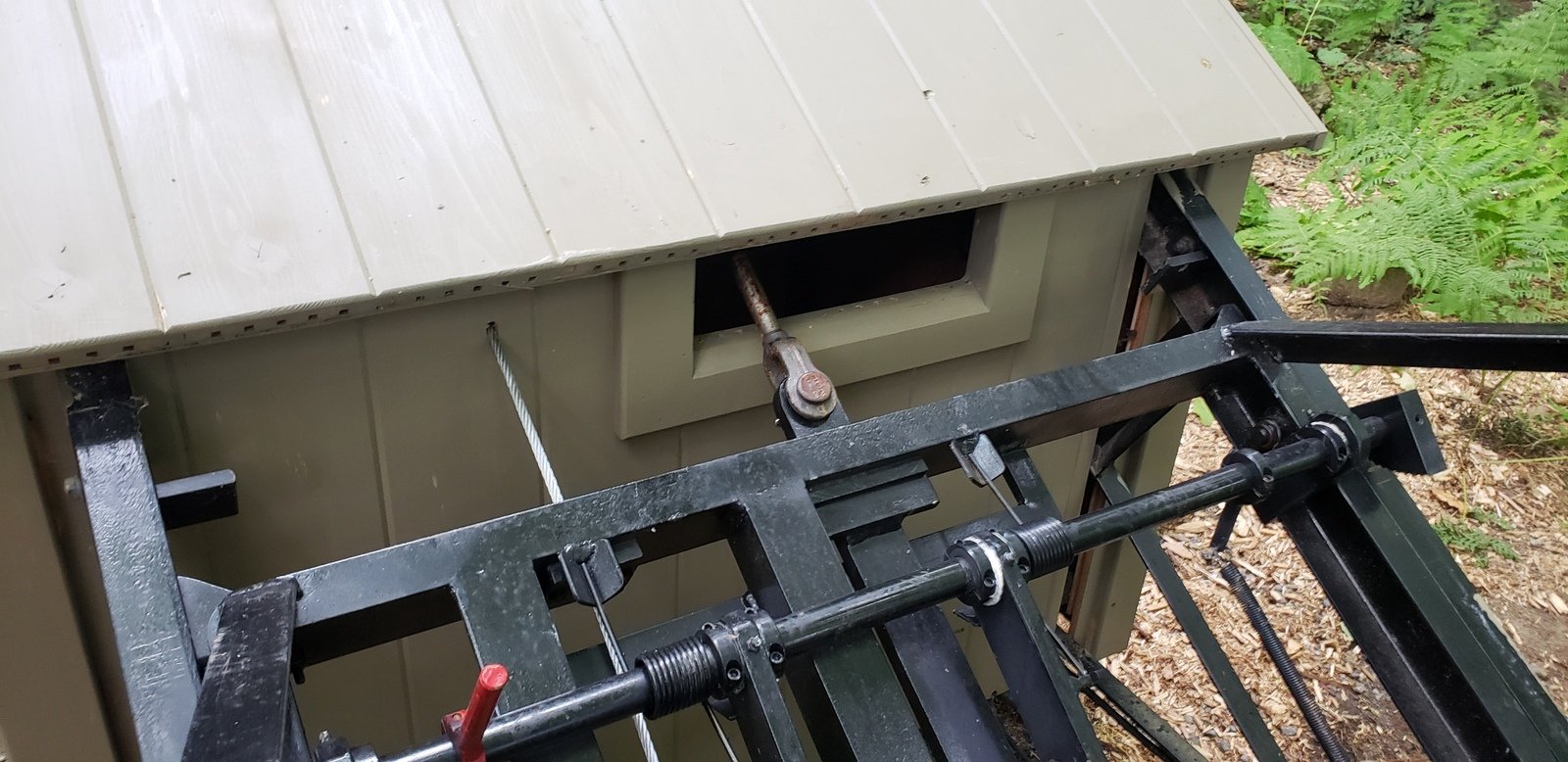 To keep the lift's intrusion into the upper garden minimal, we set the track so there is only about two feet of extra track between the bumpers on the dolly and the hard stops on the track.