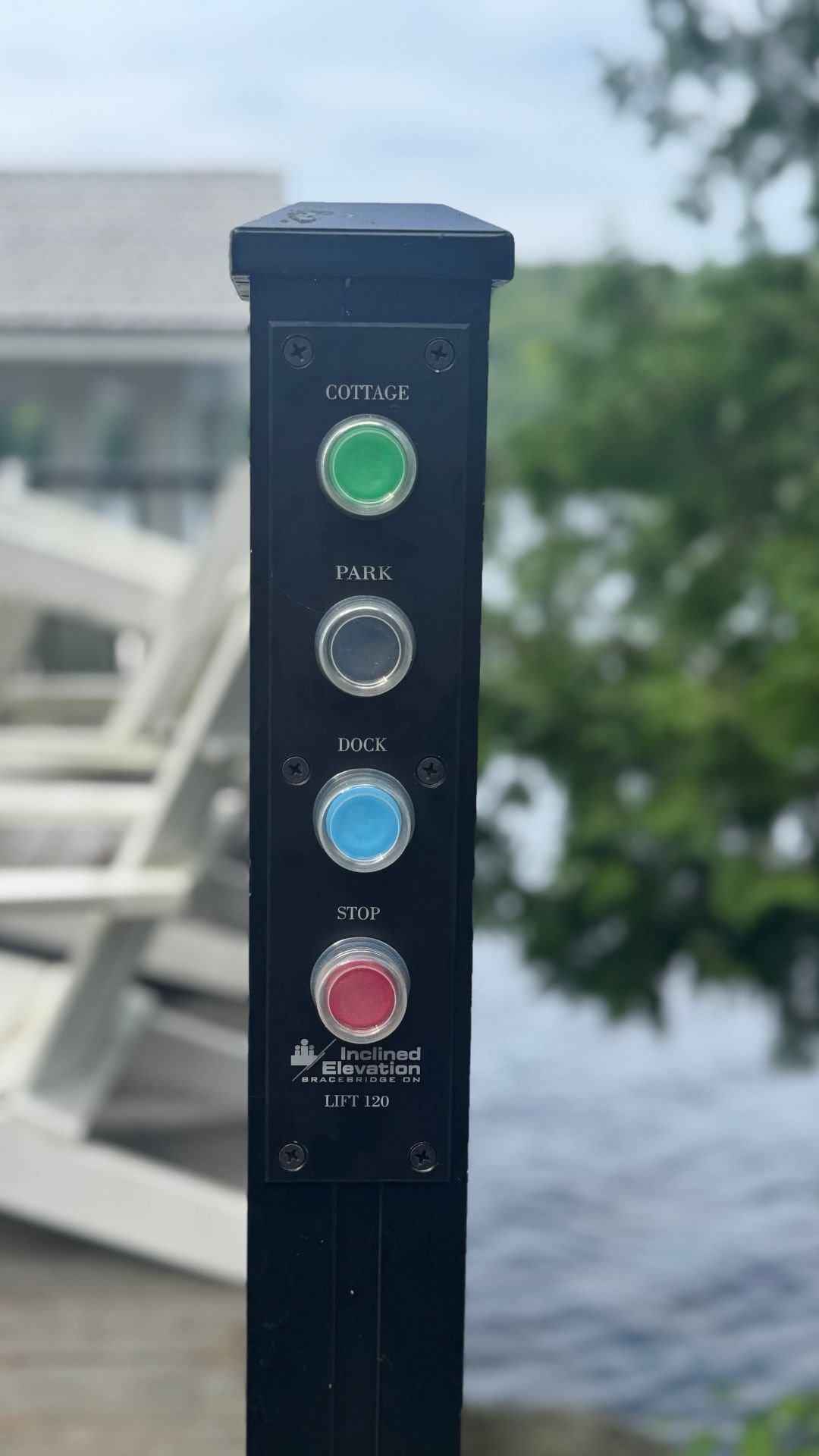 The button plates on this lift are set into the existing aluminum railing system for a clean, streamlined appearance.
