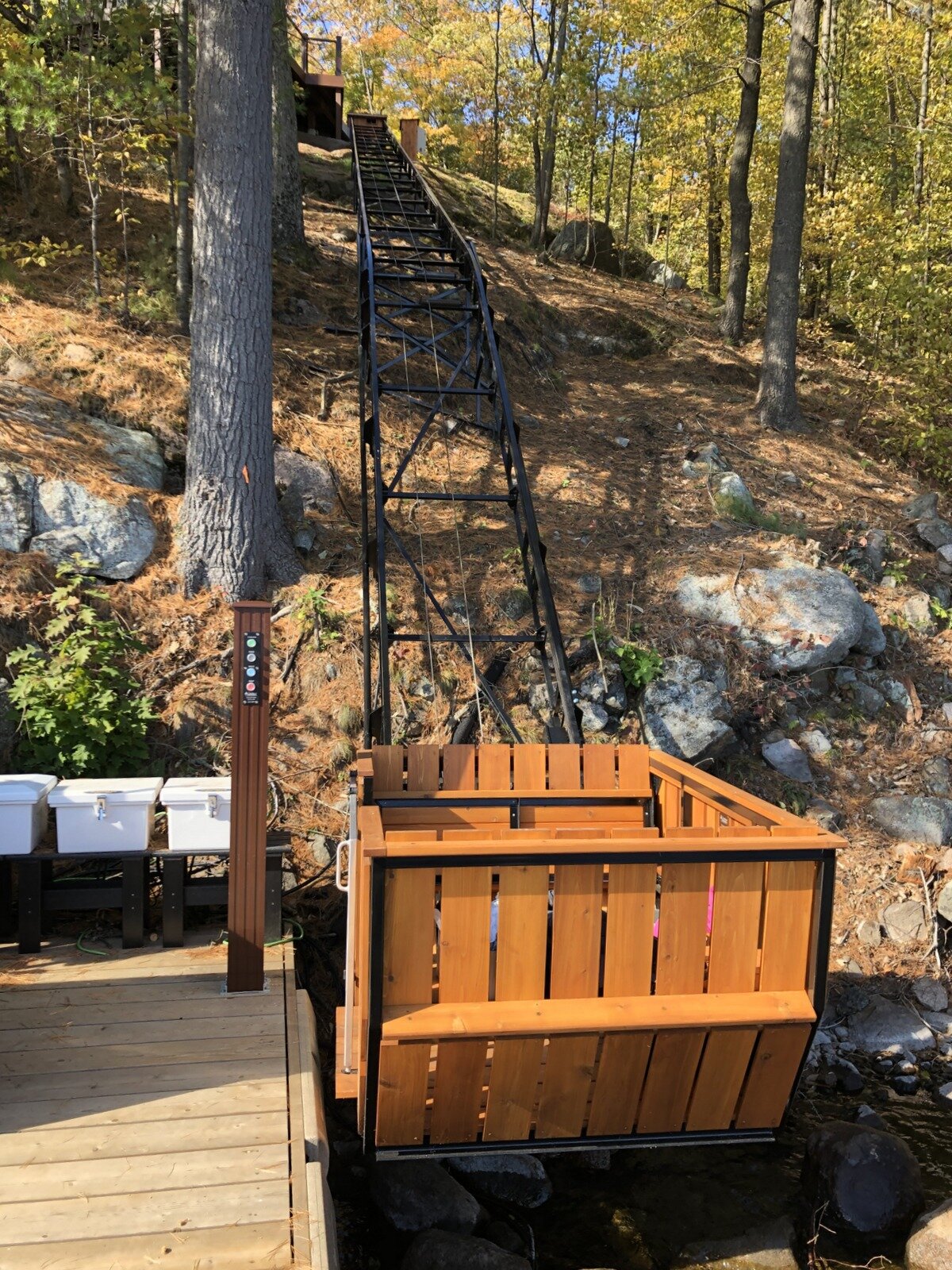 View looking up the track to the cottage. Although the steeper lower section is short, a two-pitch lift was needed to keep the track legs entirely on the shore. It also keeps the station near the shoreline and minimizes intrusion on the dock and the risk of damage from a boat.