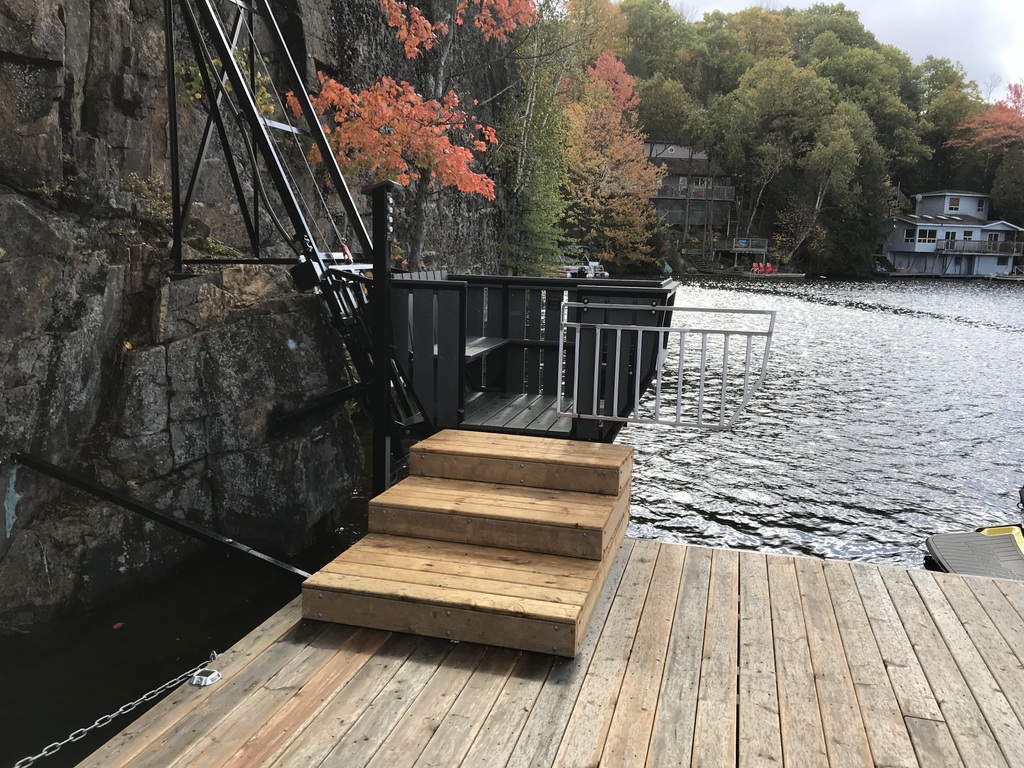Premier Docks also built an adjustable landing platform that can be set to three, two, one, or no steps to accommodate changing water levels. The lower button box is welded to the track itself, so it is always accessible from the car.