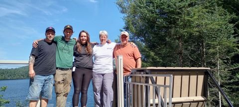 The build team—Ryan, Jason, and Sarah—with the owners Sylvie and Tim.